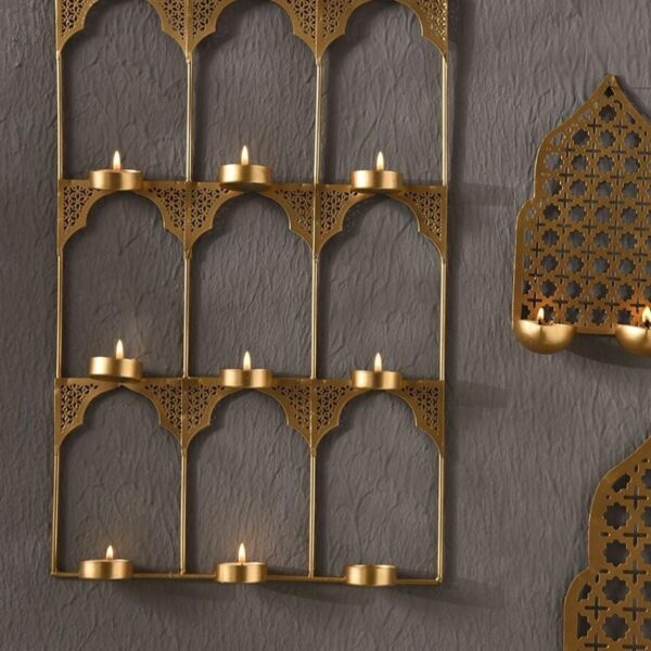 Introducing Gold Metal Tea Light Holders made of the Iron.Bring home a piece of modern Indian aesthetic, reflecting crafts. Material Iron Size(inches)- 18x12x2