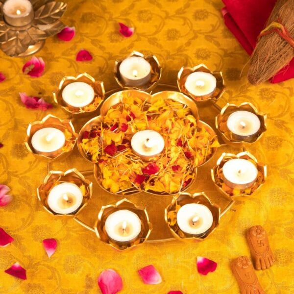 T-light stand can be placed in multiple corners of your house to help lighten up that area with bright Diya lights and also with positive energy. It has mini flower shaped tealight stands placed on the structure on the outline and has a mini urli in the centre. It's a small and petite decorative showpiece that will add charm to its surroundings, wherever placed. Size(inch)-12