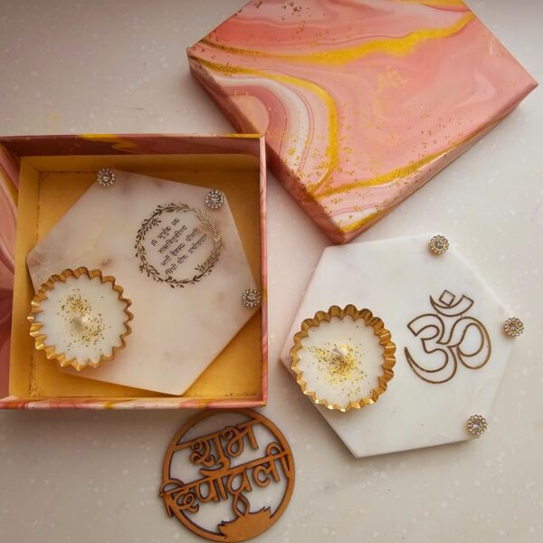 Marble hexagon metal votive candles platters for gifting this season Comes in a gifting box with shubh diwali cutout on top Variants Guruji EkOnkar Gayatri mantra OM Ganesha Namokar mantra Size approx 4 inches