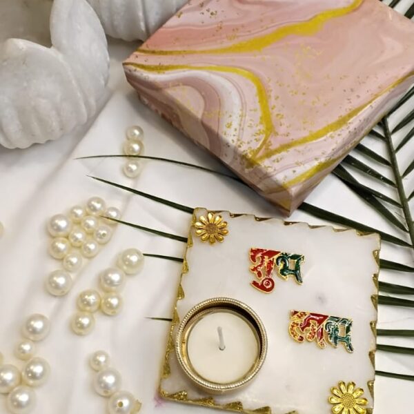 The Marble Tealight Set is a beautiful and affordable way to add a touch of luxury to your home decor. The combination of natural marble and gold plating creates a stunning visual effect, making it a perfect choice for those who appreciate elegance and sophistication.