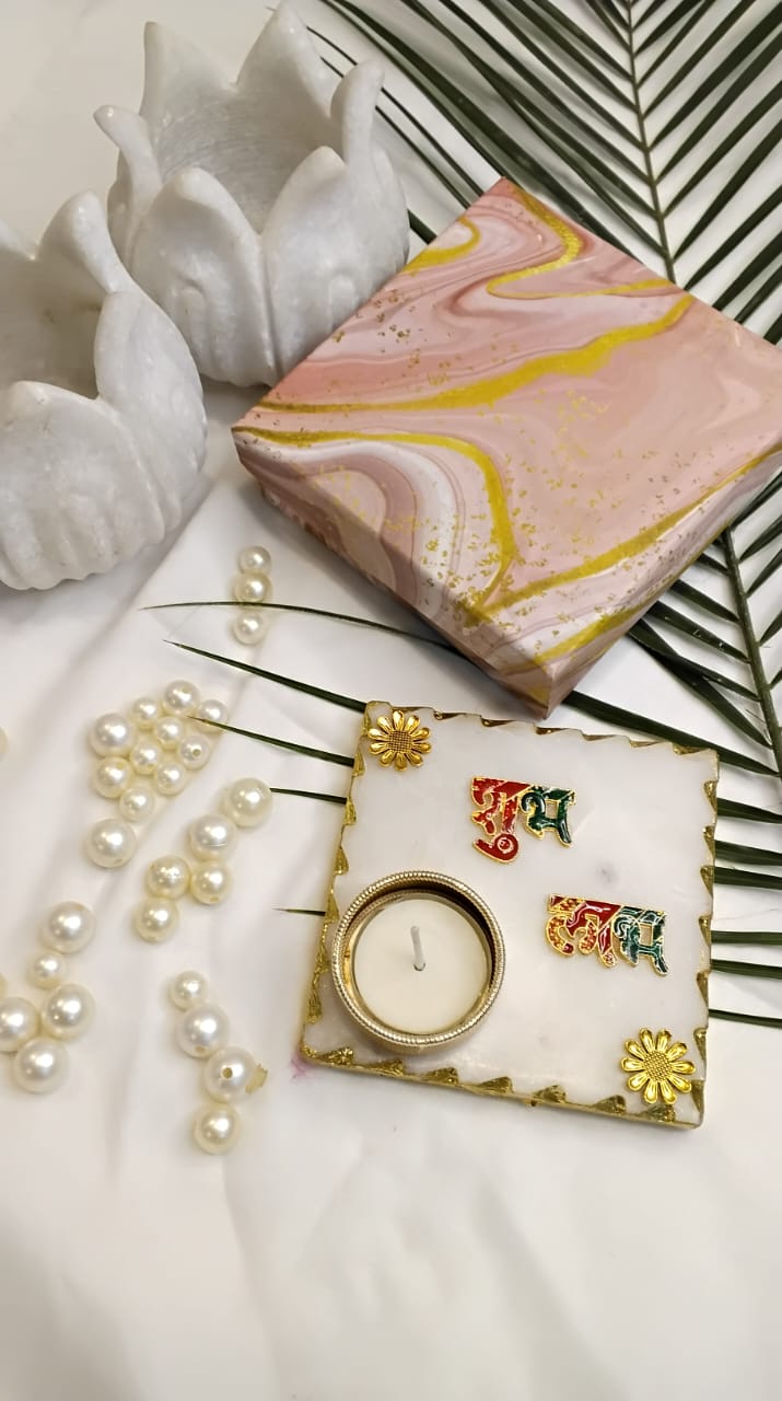 The Marble Tealight Set is a beautiful and affordable way to add a touch of luxury to your home decor. The combination of natural marble and gold plating creates a stunning visual effect, making it a perfect choice for those who appreciate elegance and sophistication.