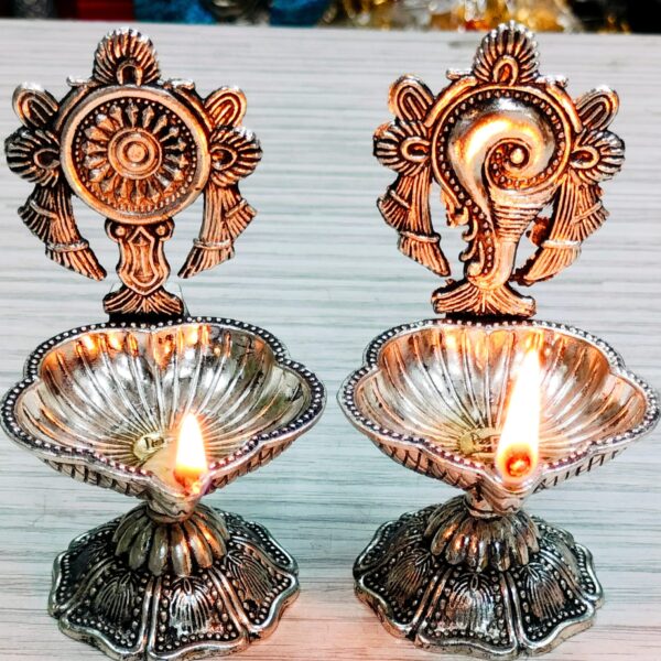 Antique German silver shankh chakra diya pair