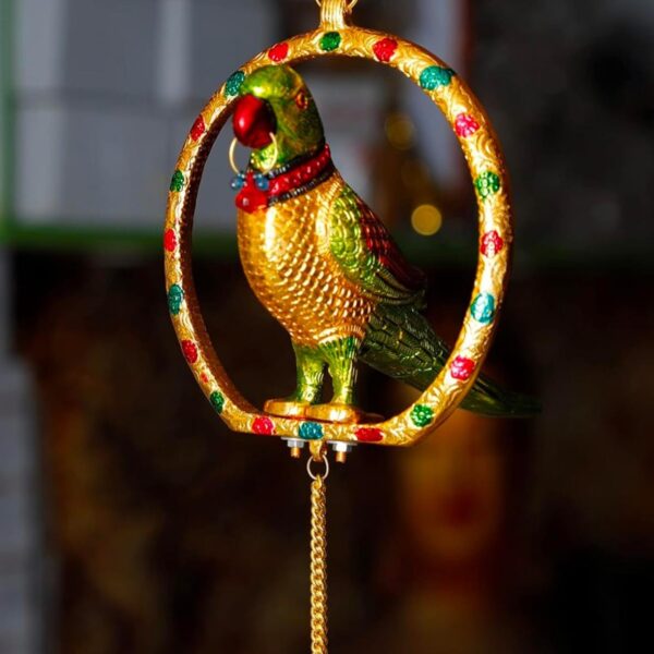 Crafted metal made hanging parrot in ring with brass finish