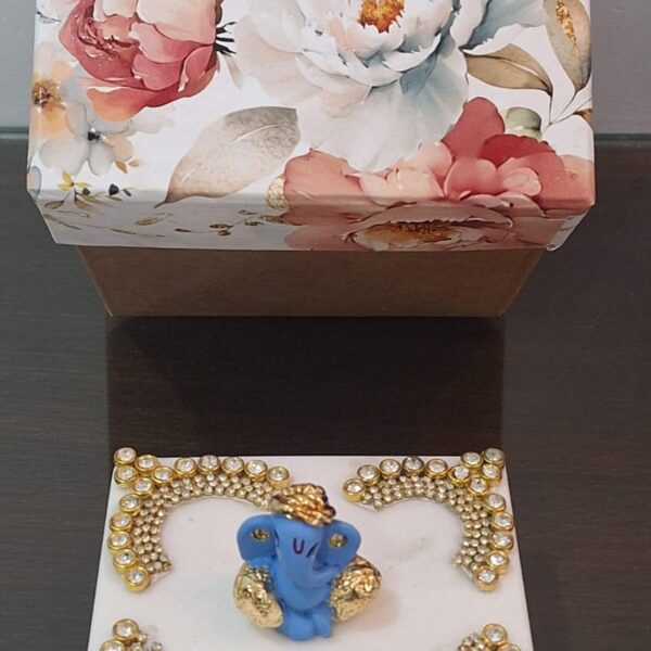 Small chawki with gold plated Ganesh