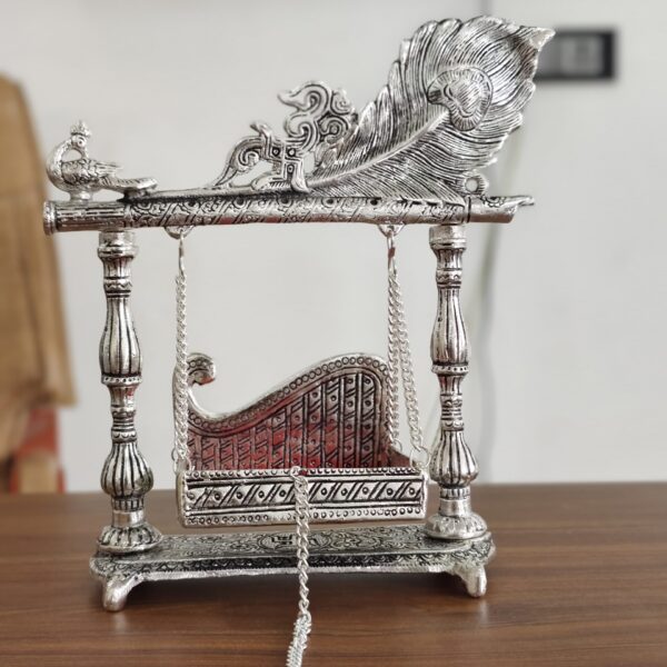 Metal jhula with peacock and pankhi bansuri